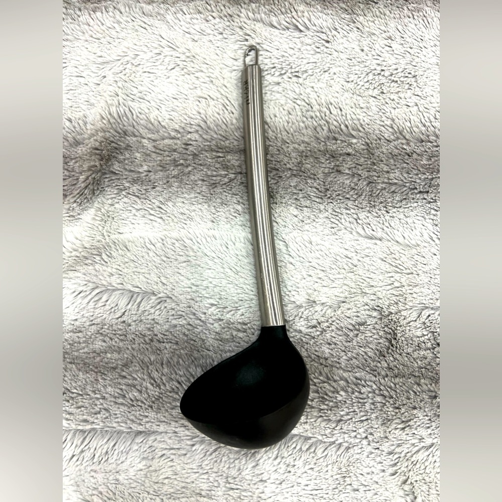 Kitchen cookware, black amd silver ladle